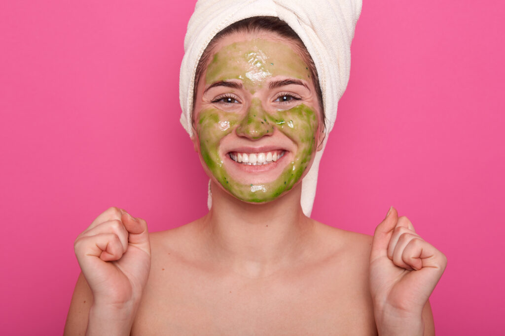 horizontal shot adorable young woman clenches fists with satisfaction