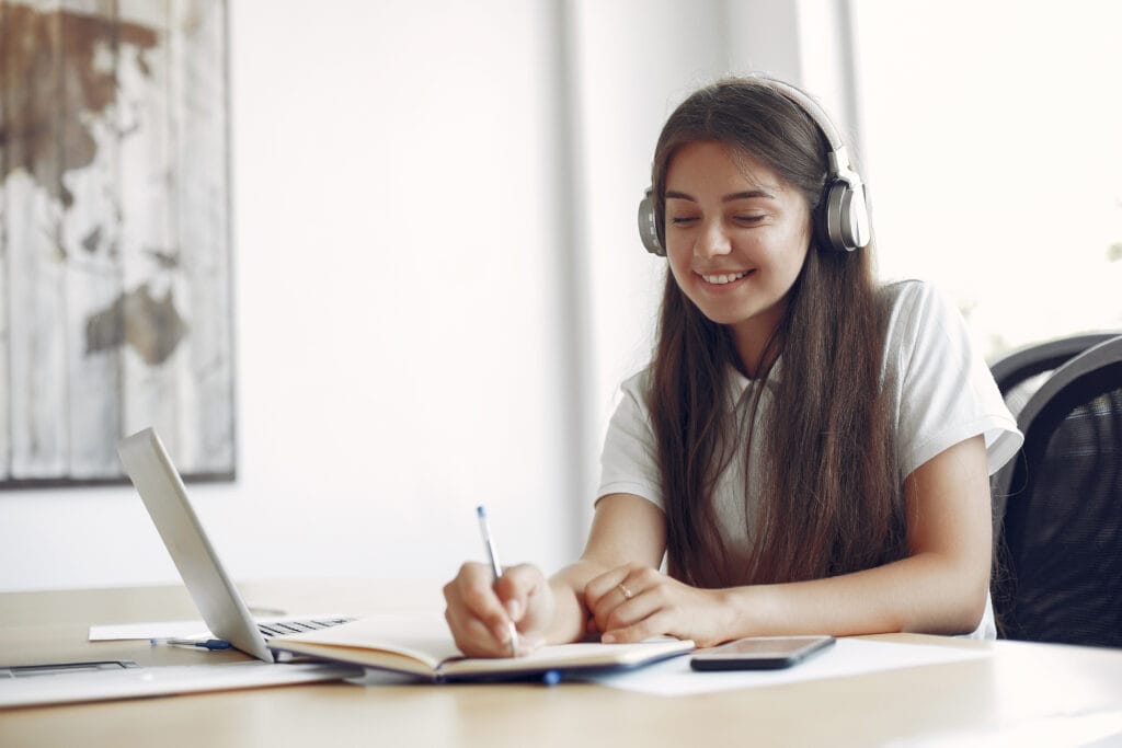 young student sitting table use laptop